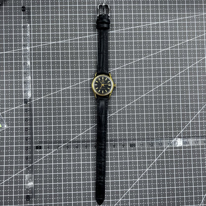 Black round case ladies watch with golden nails, Tianjin Seagull manual mechanical movement, elegant design.