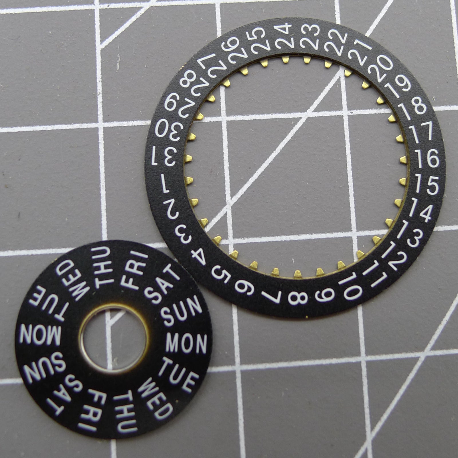 Pilot black date and week disk wheels for Dandong 7750 movement, precise fit for watch repair.