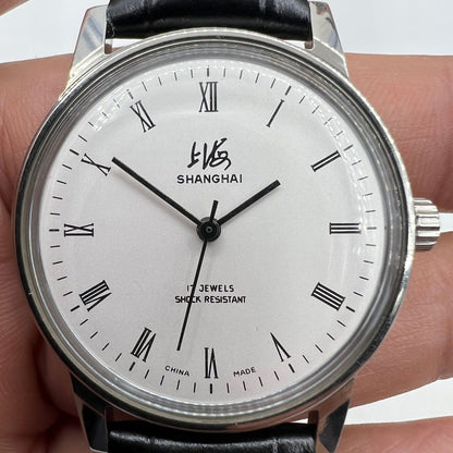 Vintage 36mm Shanghai Factory 8120 manual watch with shock-resistant 17 jewels, classic mechanical design.