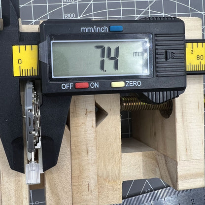 Miyota NH36A automatic watch movement with white dial, blue luminescent markers, and triple crown precision controls.