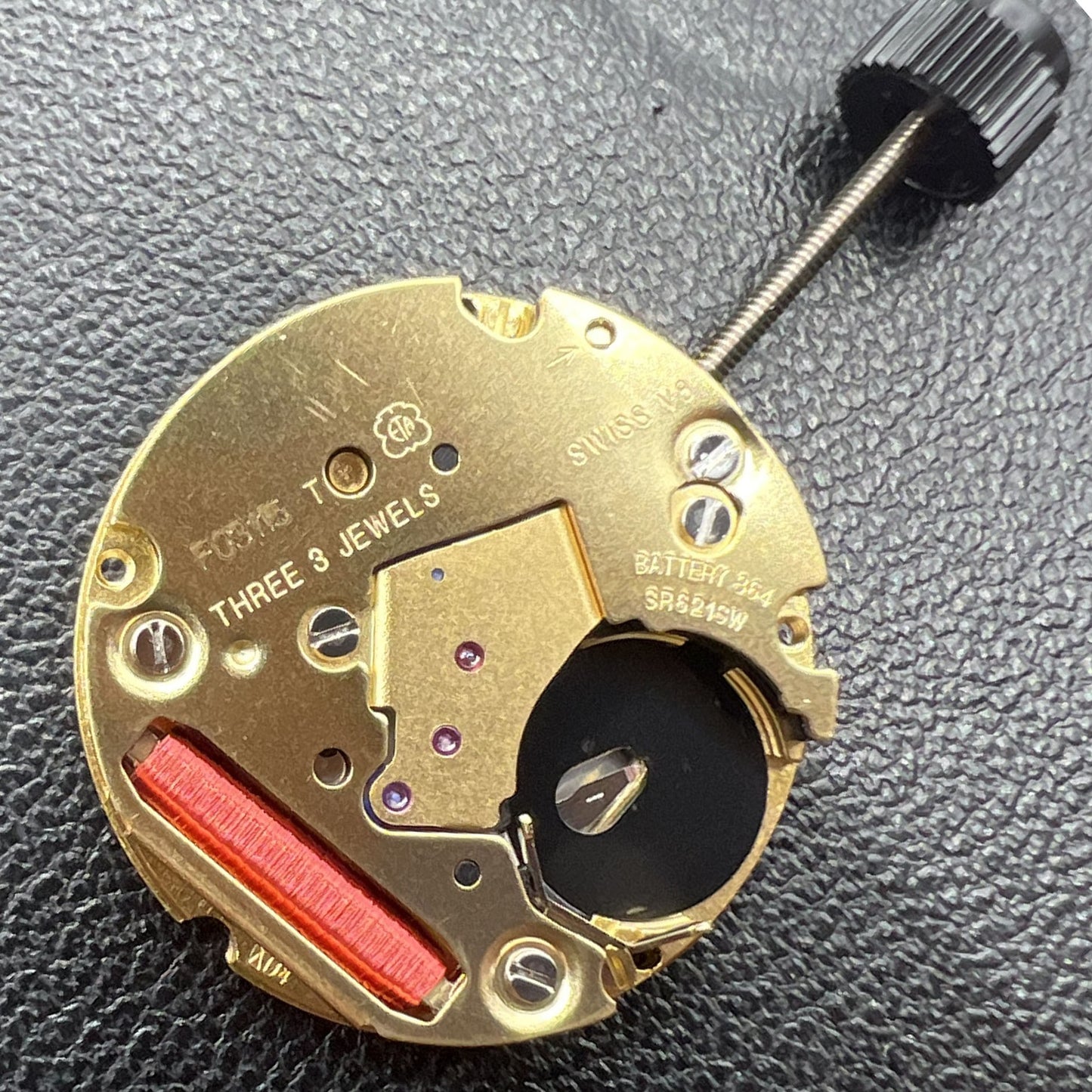 ETA F03.115 quartz watch movement with 3 hands and date window at 3 o'clock for precise timekeeping.