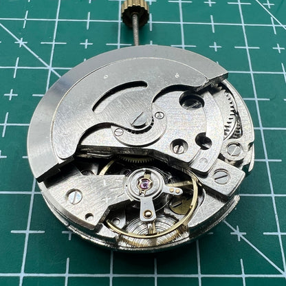 26.5mm 7120 mechanical watch movement with single calendar and three hands, ensuring precise timekeeping.