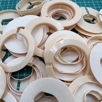 Set of 54 AC-676 watch movement case spacers, precise 27 ligne sizes for repair accuracy