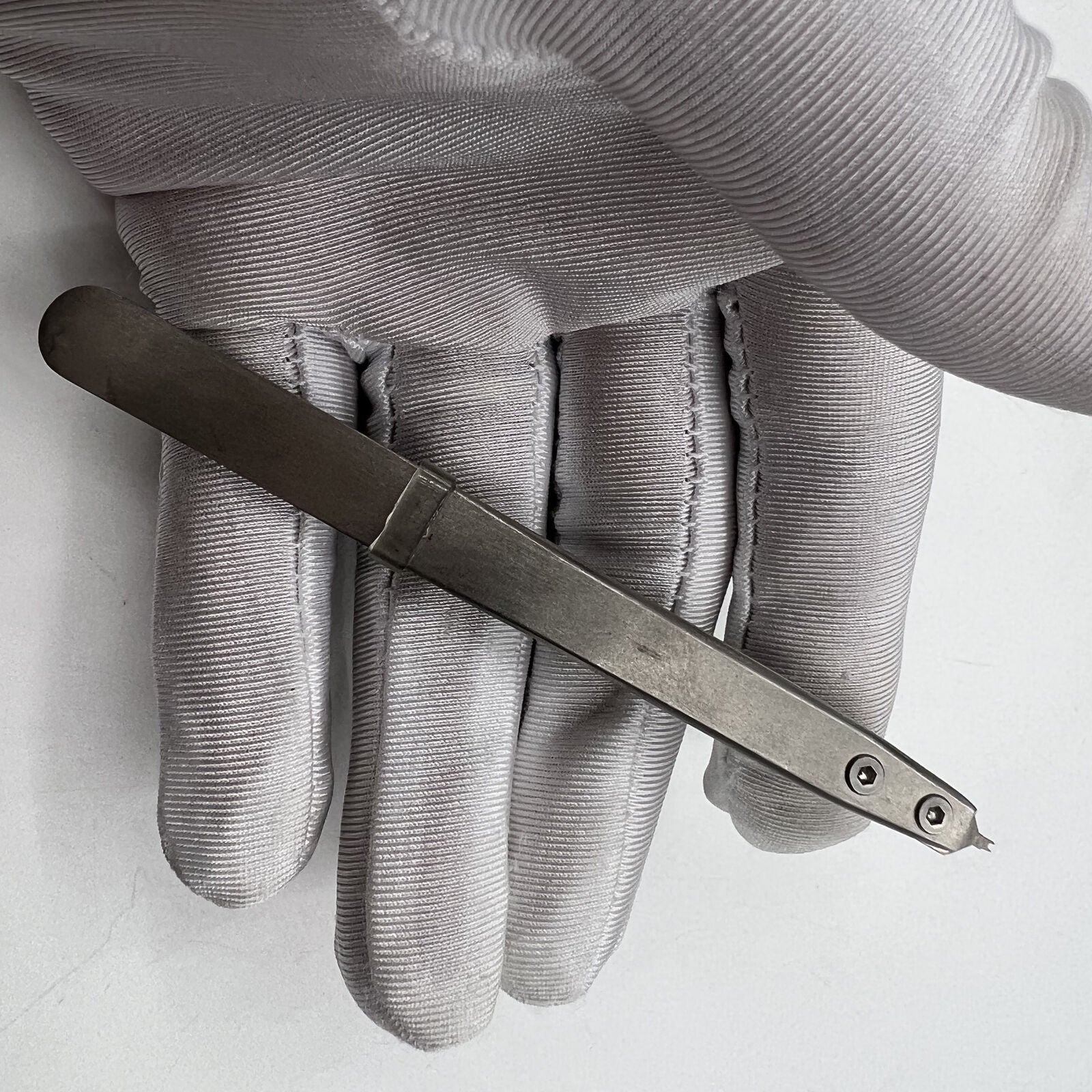 Precision Bergeon 7825 spring bar tweezer for watch lug removal and fitting accessories.