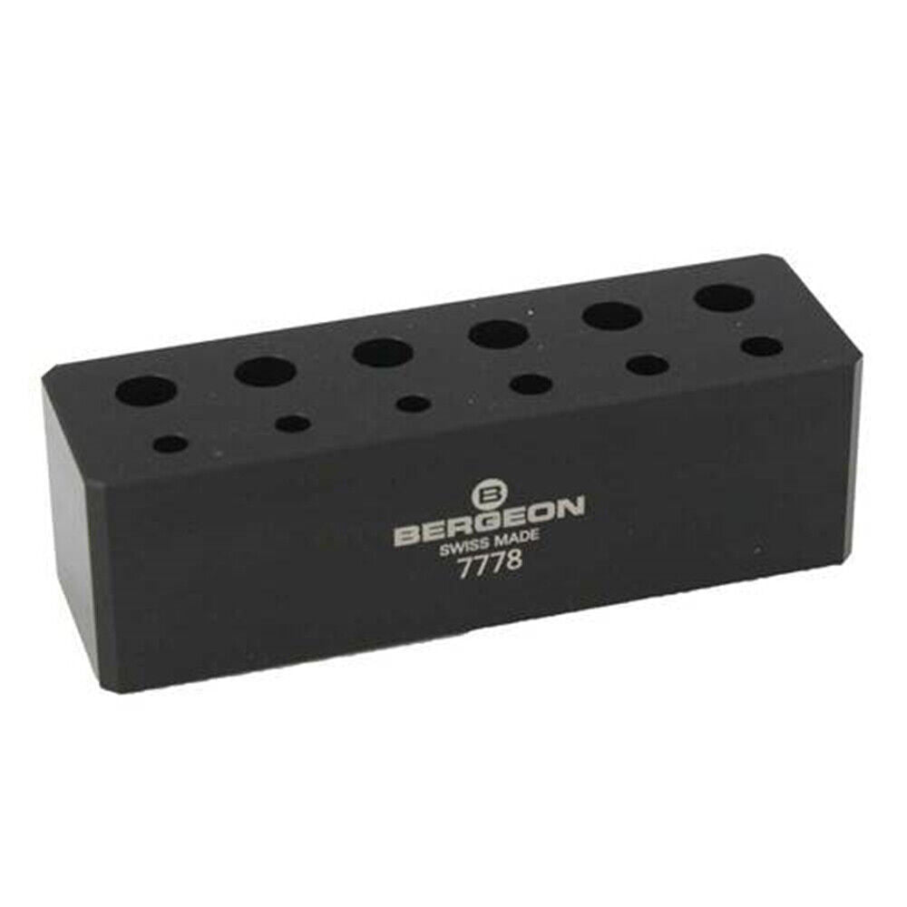 Swiss Bergeon 7778 precision watch screwdriver set with 6 blades, spare tips, and organizer stand for fine watch repair.