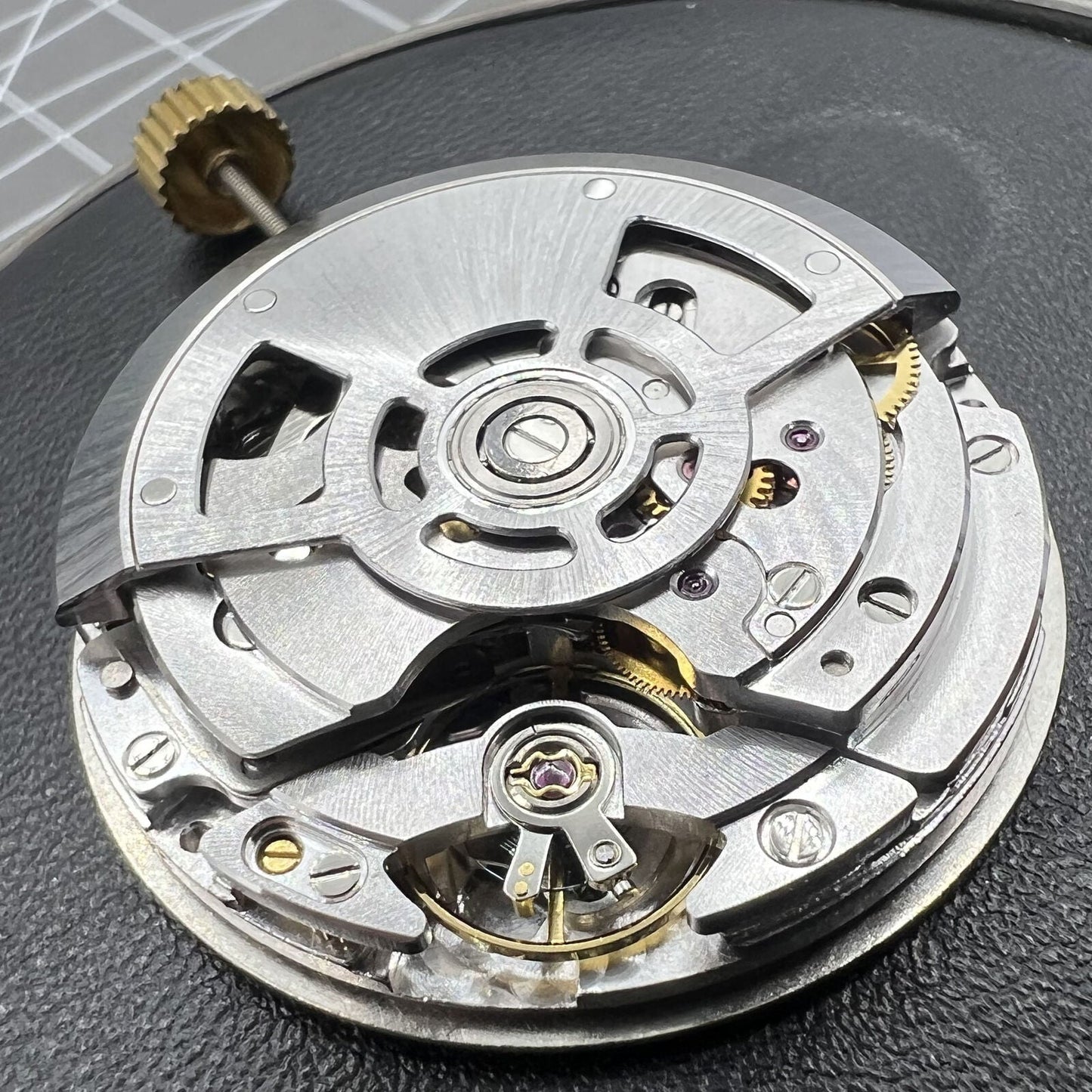 SL4801 automatic watch with mechanical movement and small second subdials at 3, 6, and 9 o?clock.