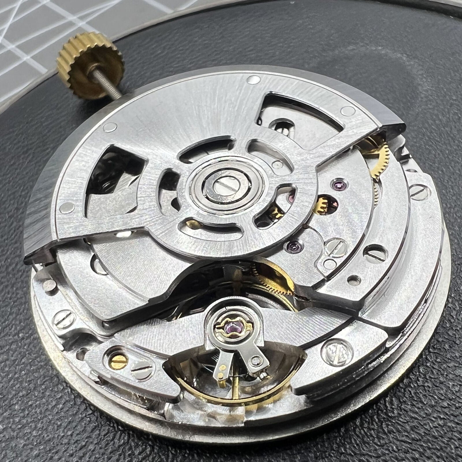 SL4801 automatic watch with mechanical movement and small second subdials at 3, 6, and 9 o?clock.