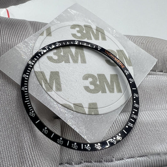 38,5 mm Uhrenlünette aus Aluminiumlegierung, schwarzer Ring + weiße Schrift für Omega Speedmaster 