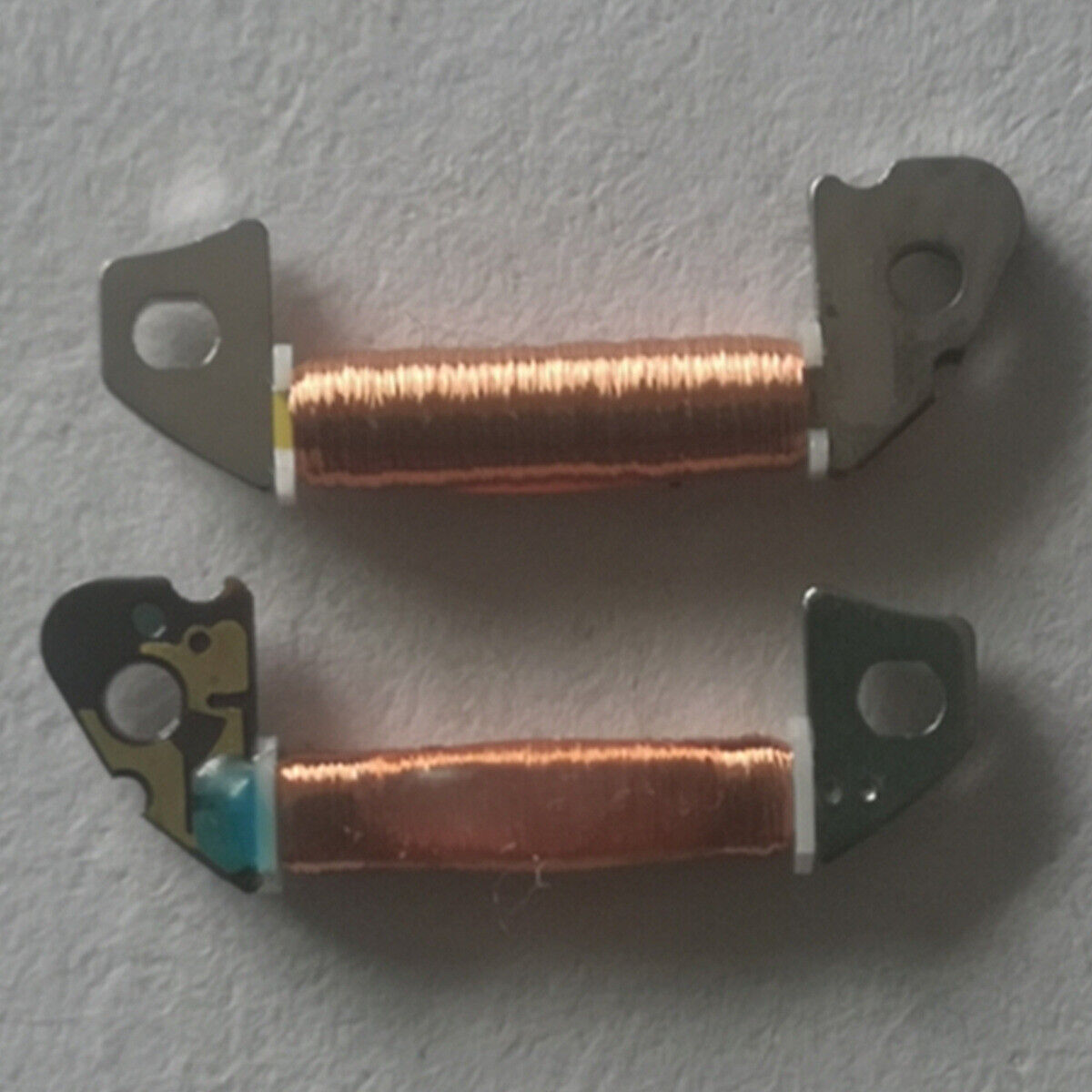 Set of 2 Hattori Epson circuit board coils for VD53C and VD57B quartz watch movements, precise replacement parts.