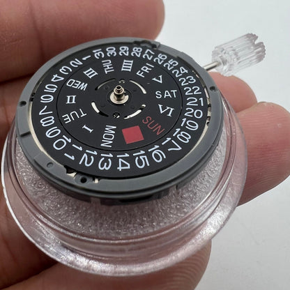 Black NH36A automatic watch movement with Roman wheel and crown positioned at 3 o'clock.