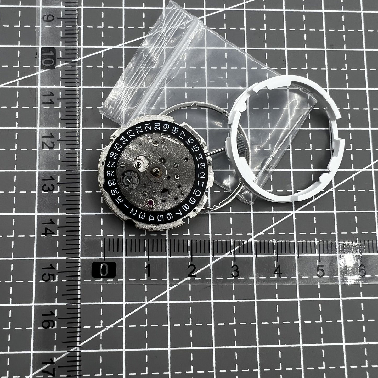Citizen Miyota 8215 automatic mechanical watch movement with black dial and date display at 3 o'clock.