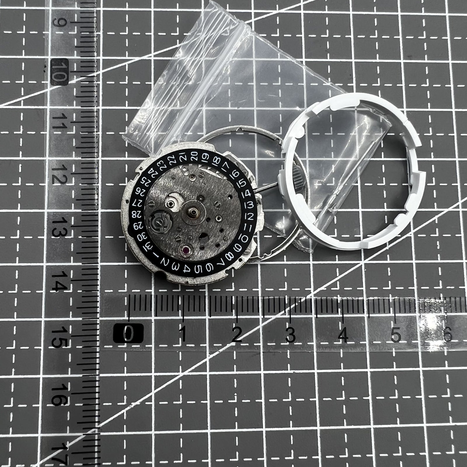 Citizen Miyota 8215 automatic mechanical watch movement with black dial and date display at 3 o'clock.