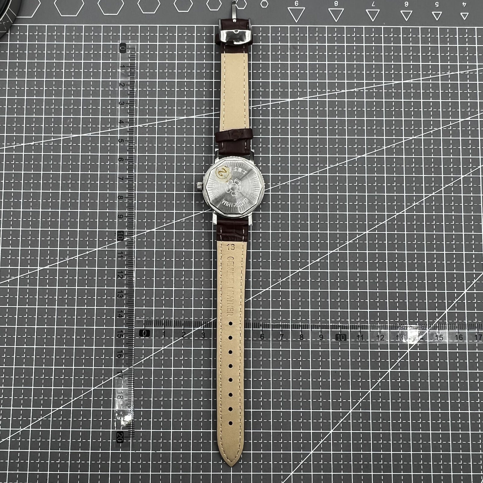 Shanghai 33mm manual mechanical watch with 17 jewels, single calendar, and shock-resistant design for precise timekeeping.