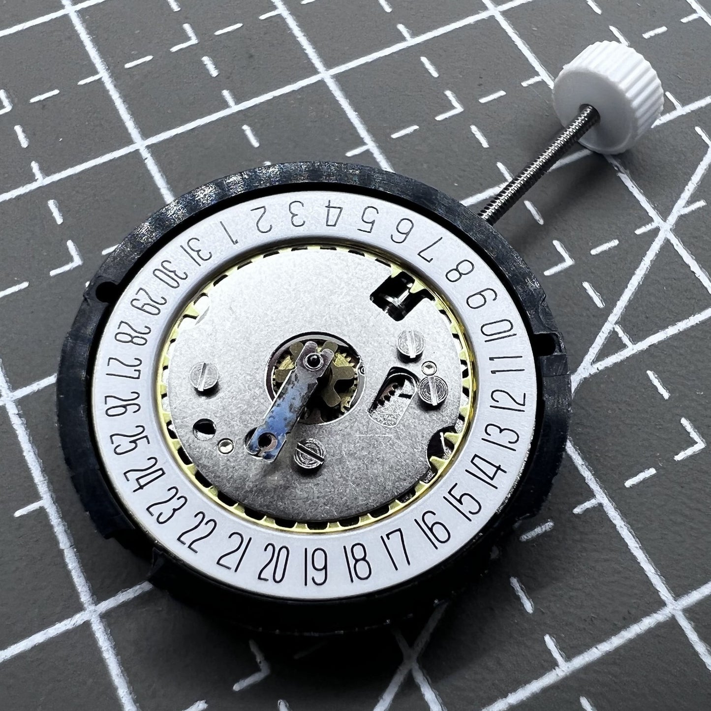 Ronda 585 Swiss quartz watch movement with date at 6 o'clock, precision timekeeping.