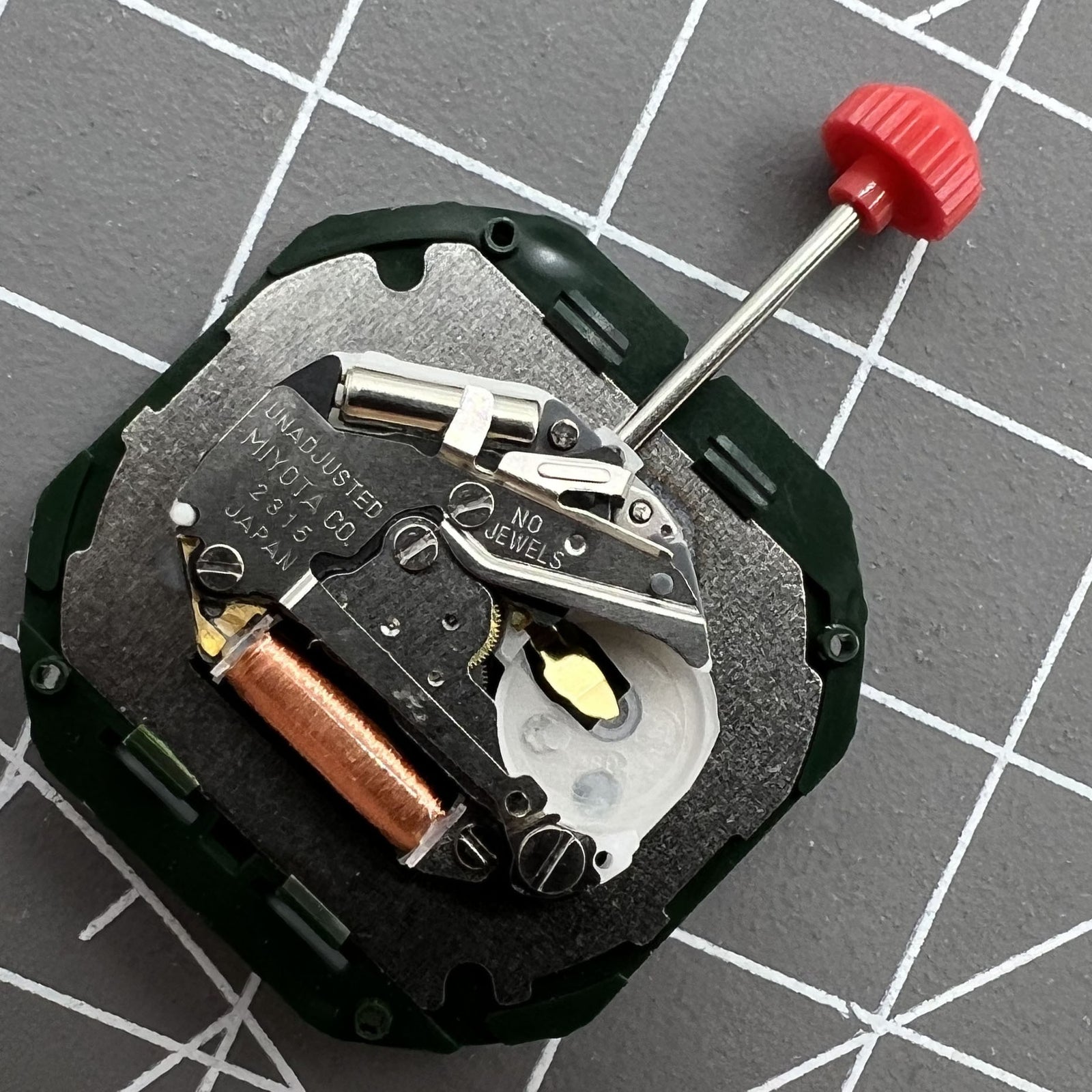 Black dial watch with Miyota 2315 quartz movement, date at 6, 3 hands, compatible stem by Miyota.