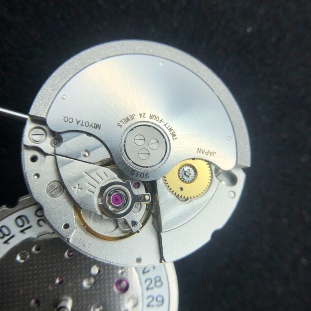 Miyota Citizen 9015 automatic watch movement showing date feature at 3 and 6 o?clock positions.