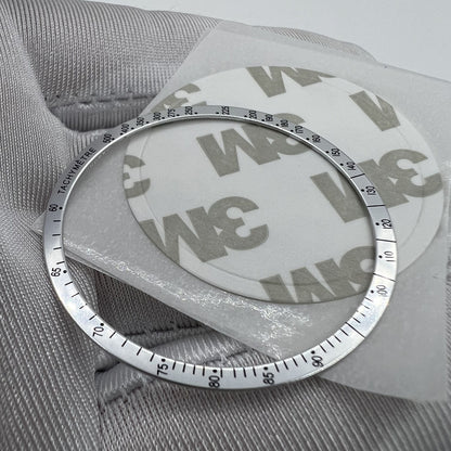 38.5mm aluminum alloy white bezel with black font for Omega Speedmaster enhancing watch durability.