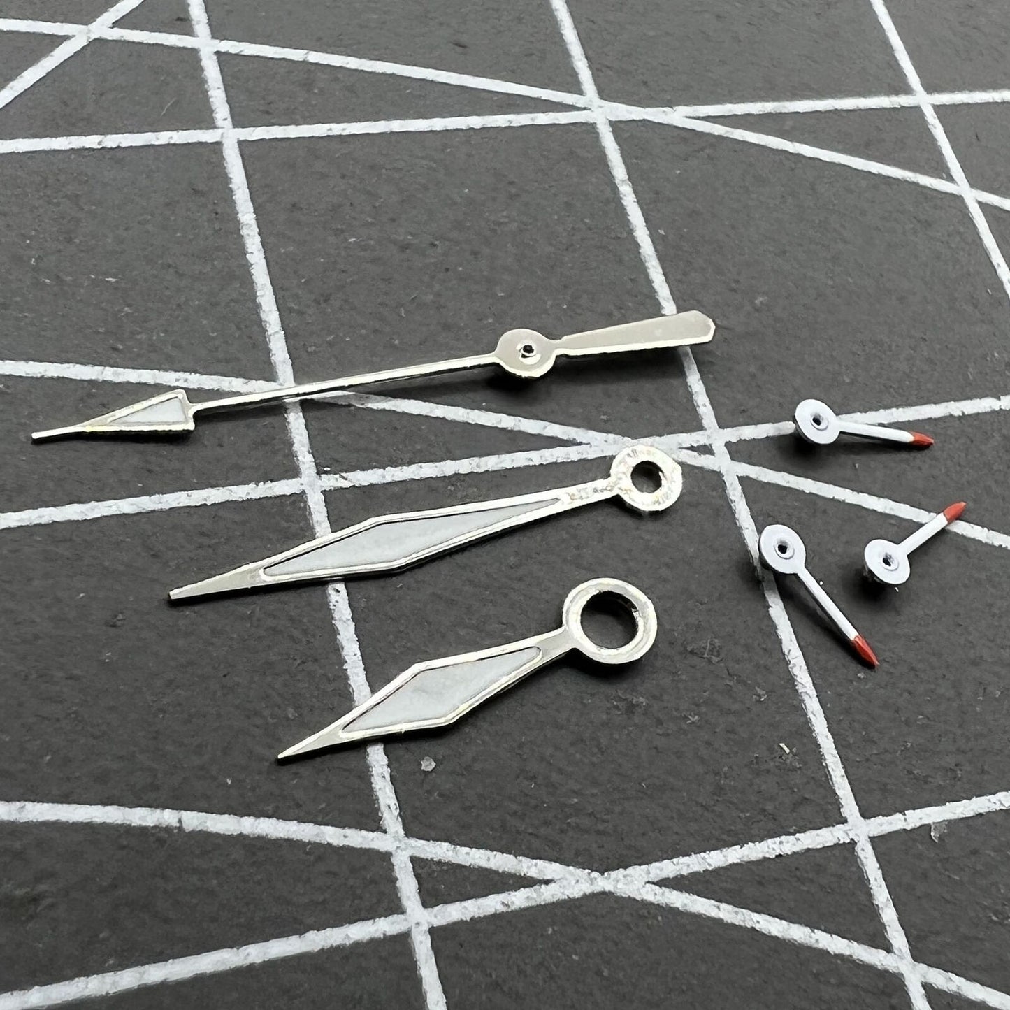 Red and white luminous small second watch hands for Miyota OS series, precision-crafted.