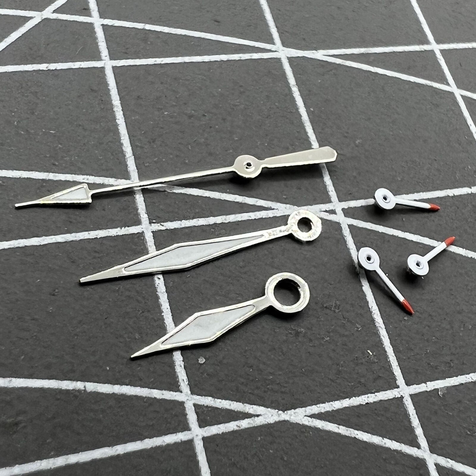 Red and white luminous small second watch hands for Miyota OS series, precision-crafted.