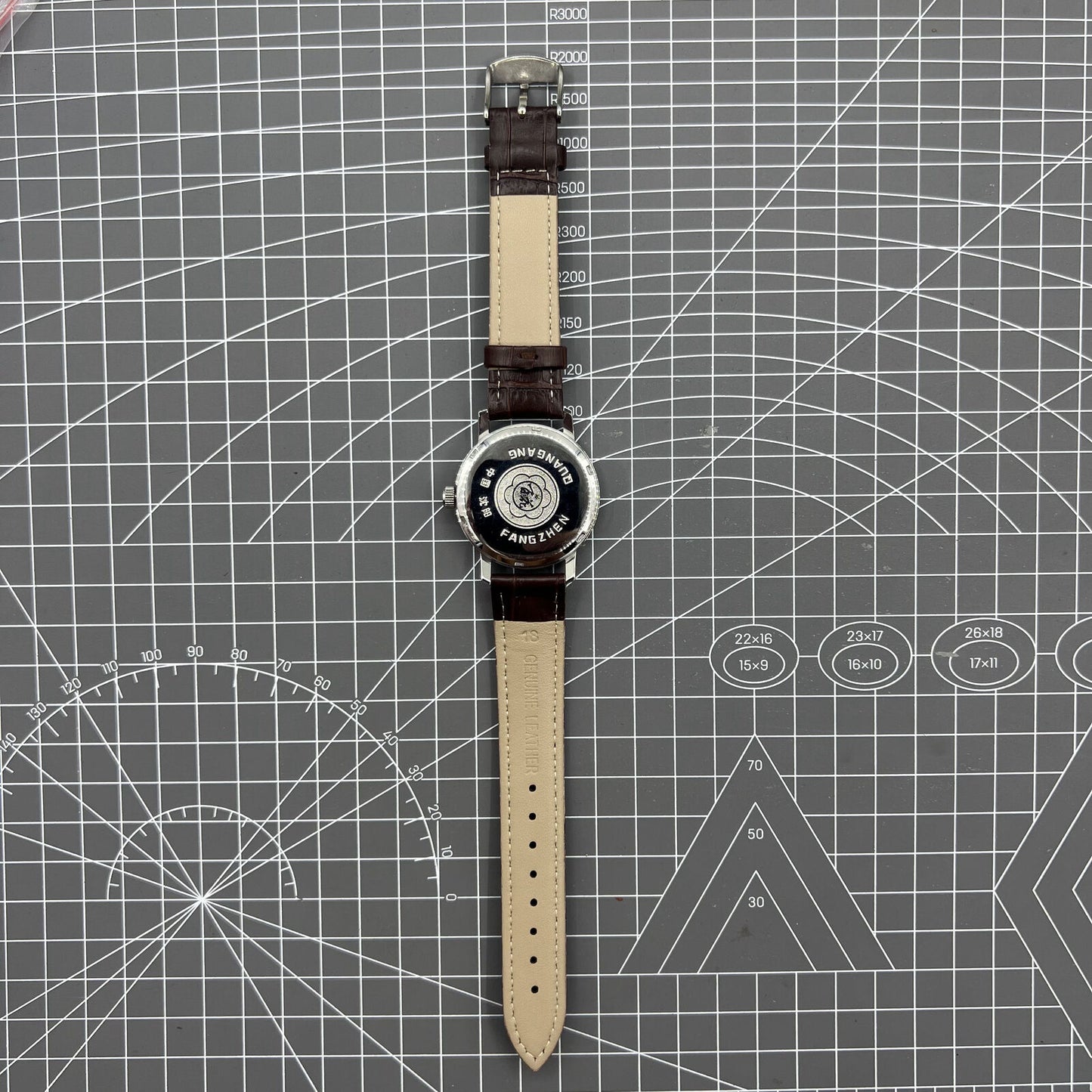 China Baihua 37mm manual mechanical watch with silver dial, 19 jewels, and durable shock-resistant build.