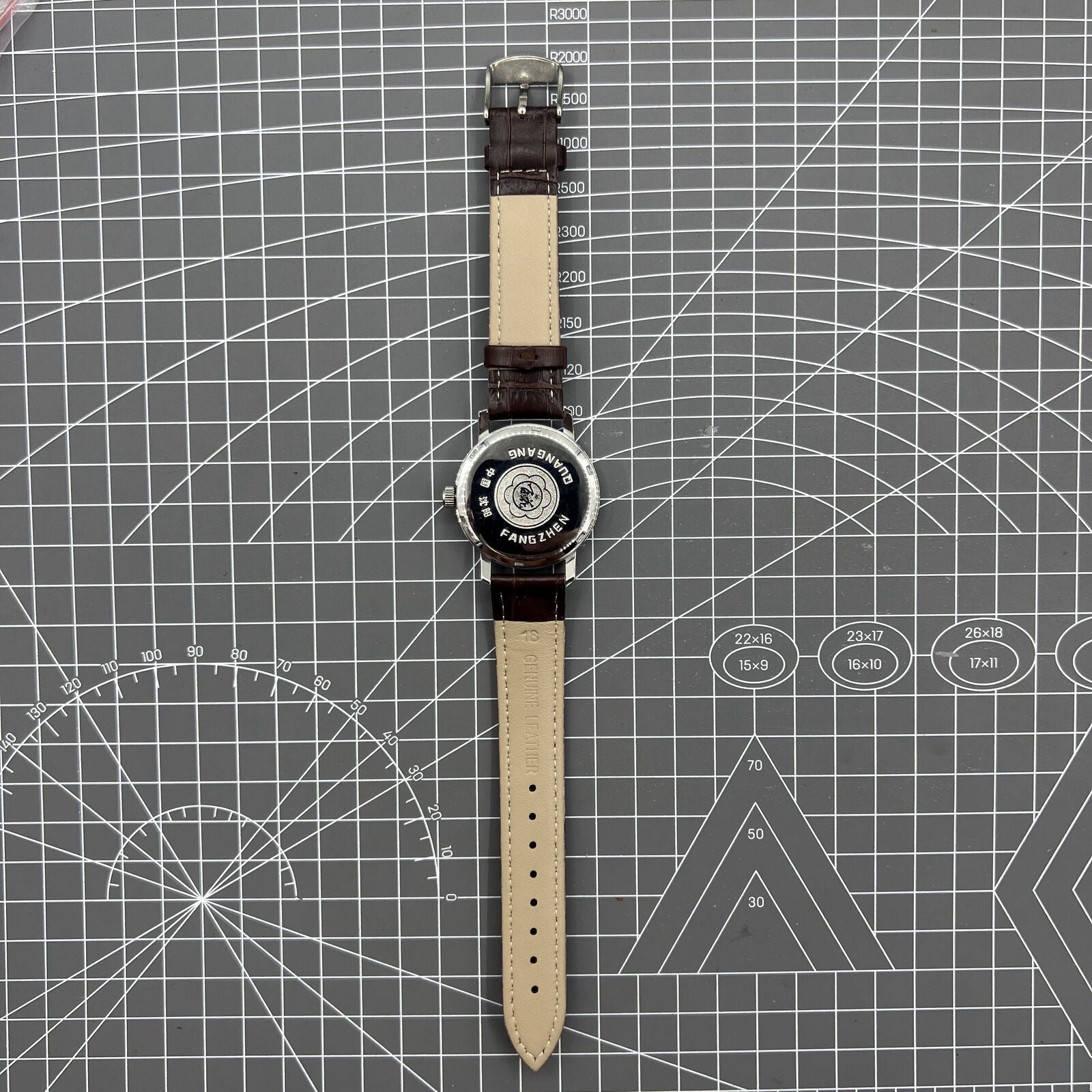 China Baihua 37mm manual mechanical watch with silver dial, 19 jewels, and durable shock-resistant build.