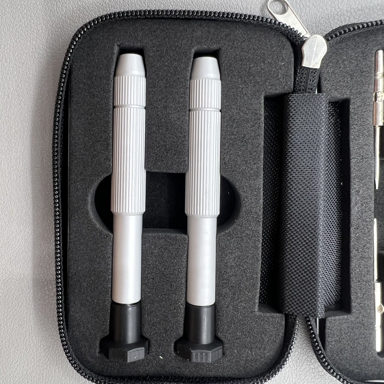 Precision screwdriver set for watch and eyeglass repair, includes hex tools and cutter heads with grip handle.