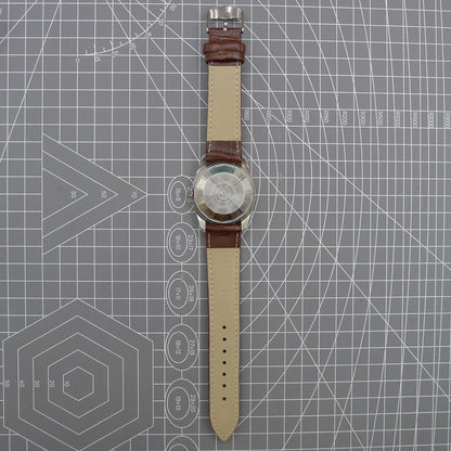 Dandong Peacock 37mm manual watch with golden dial, single calendar, 33 jewels, elegant style.