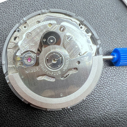 Seiko NH35 automatic watch movement with high precision and vibrant orange dial, ideal for watch repairs.