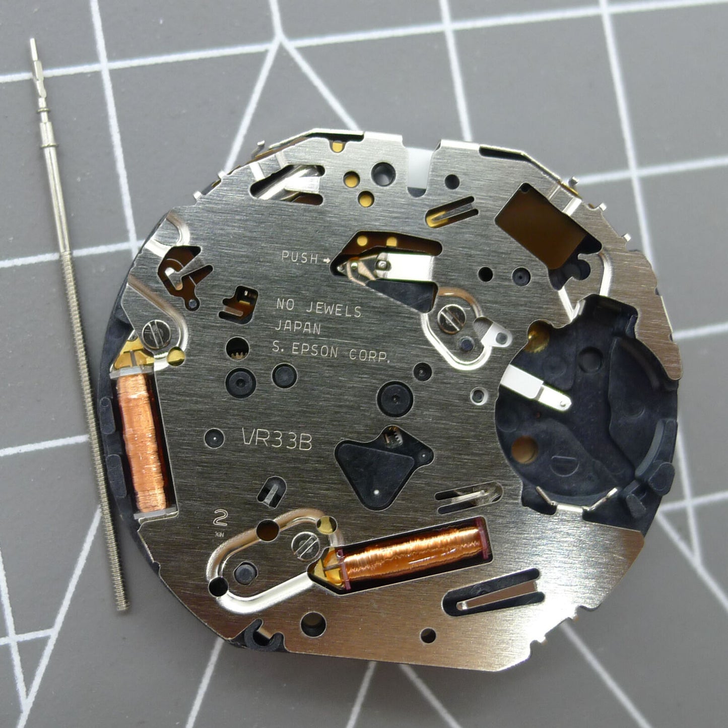 Japan Made VR32B quartz watch movement with black dial showcasing multifunctional features for accurate timekeeping.