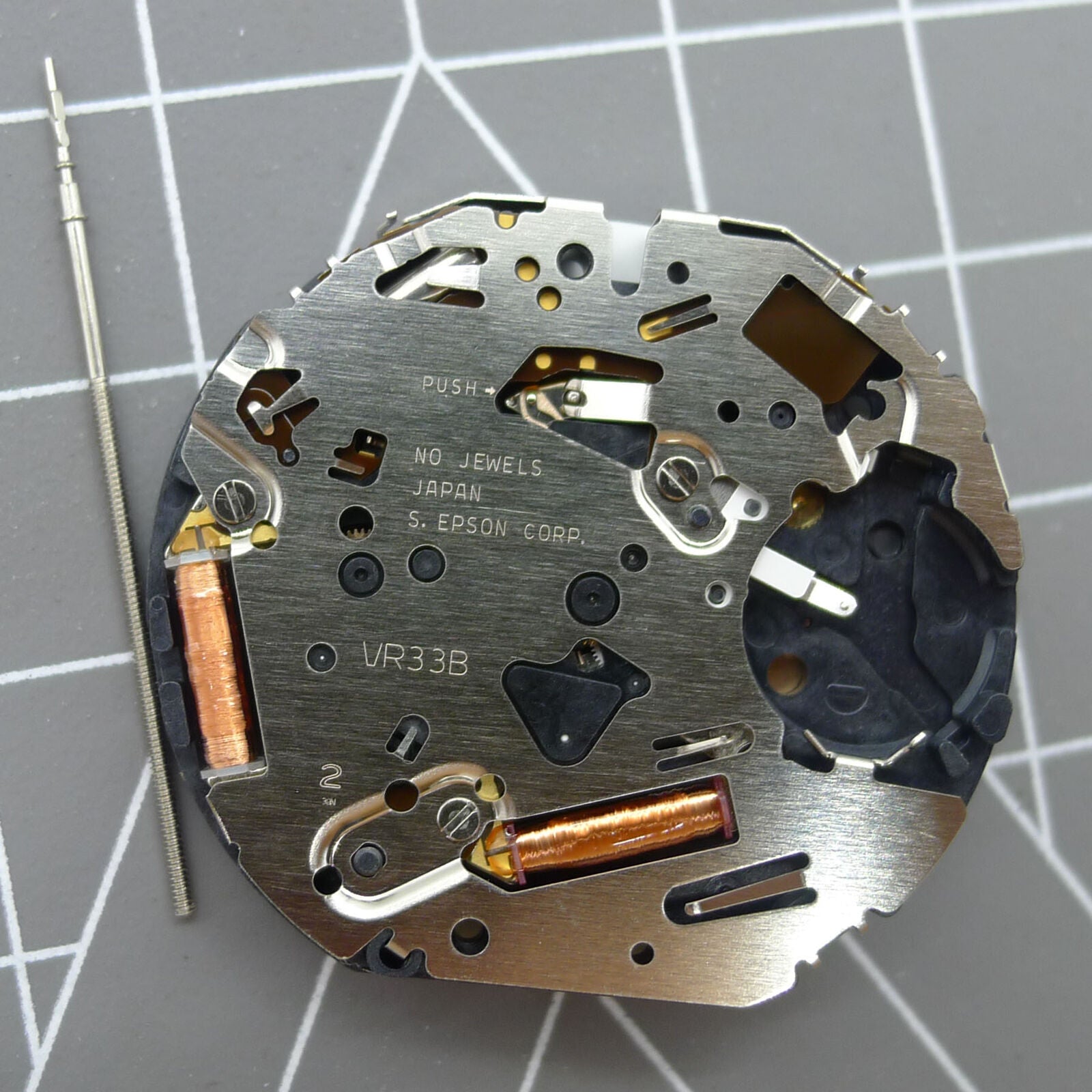 Japan Made VR32B quartz watch movement with black dial showcasing multifunctional features for accurate timekeeping.