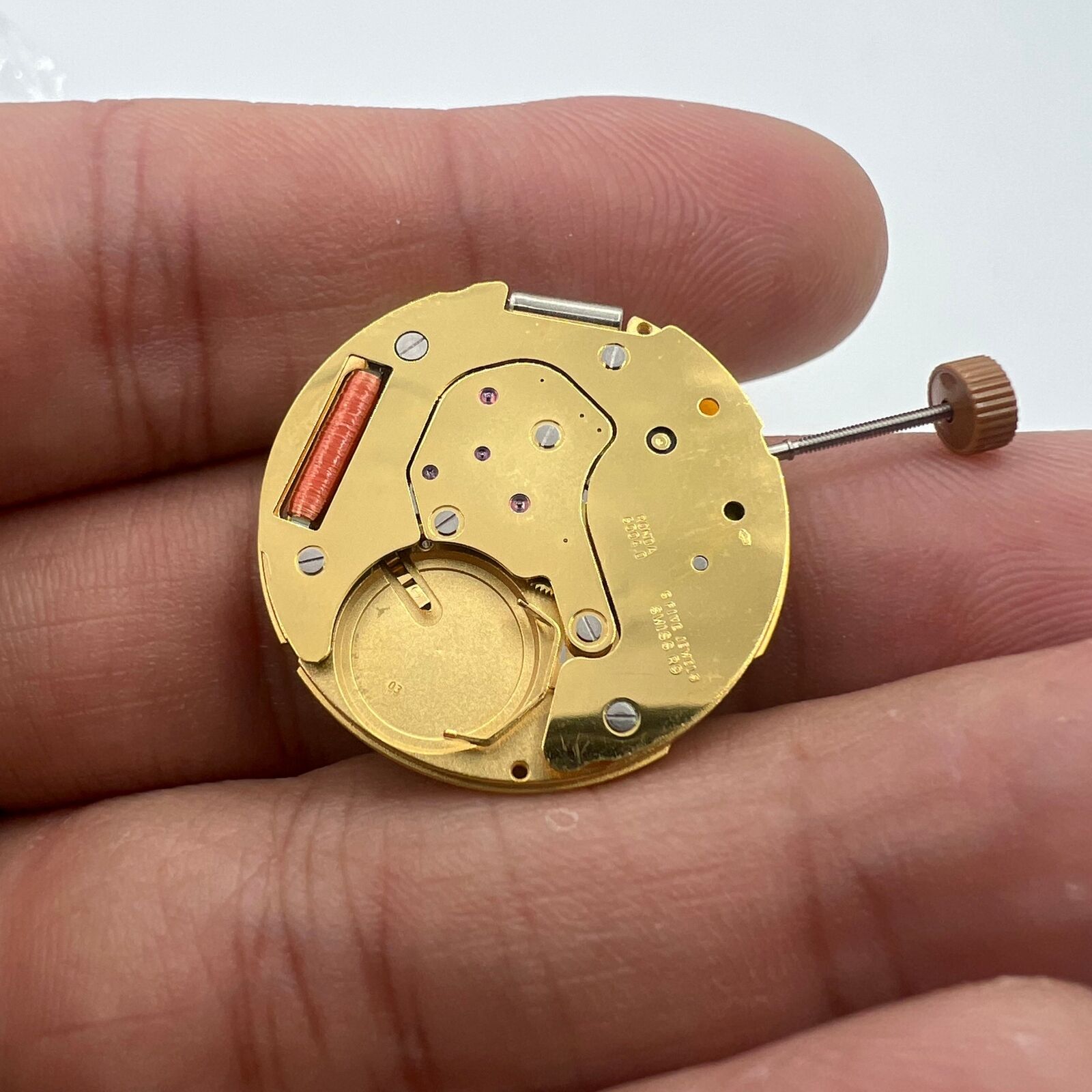Swiss Made Ronda 6004D quartz watch movement with date display, precise timing accessory for watch repairs.