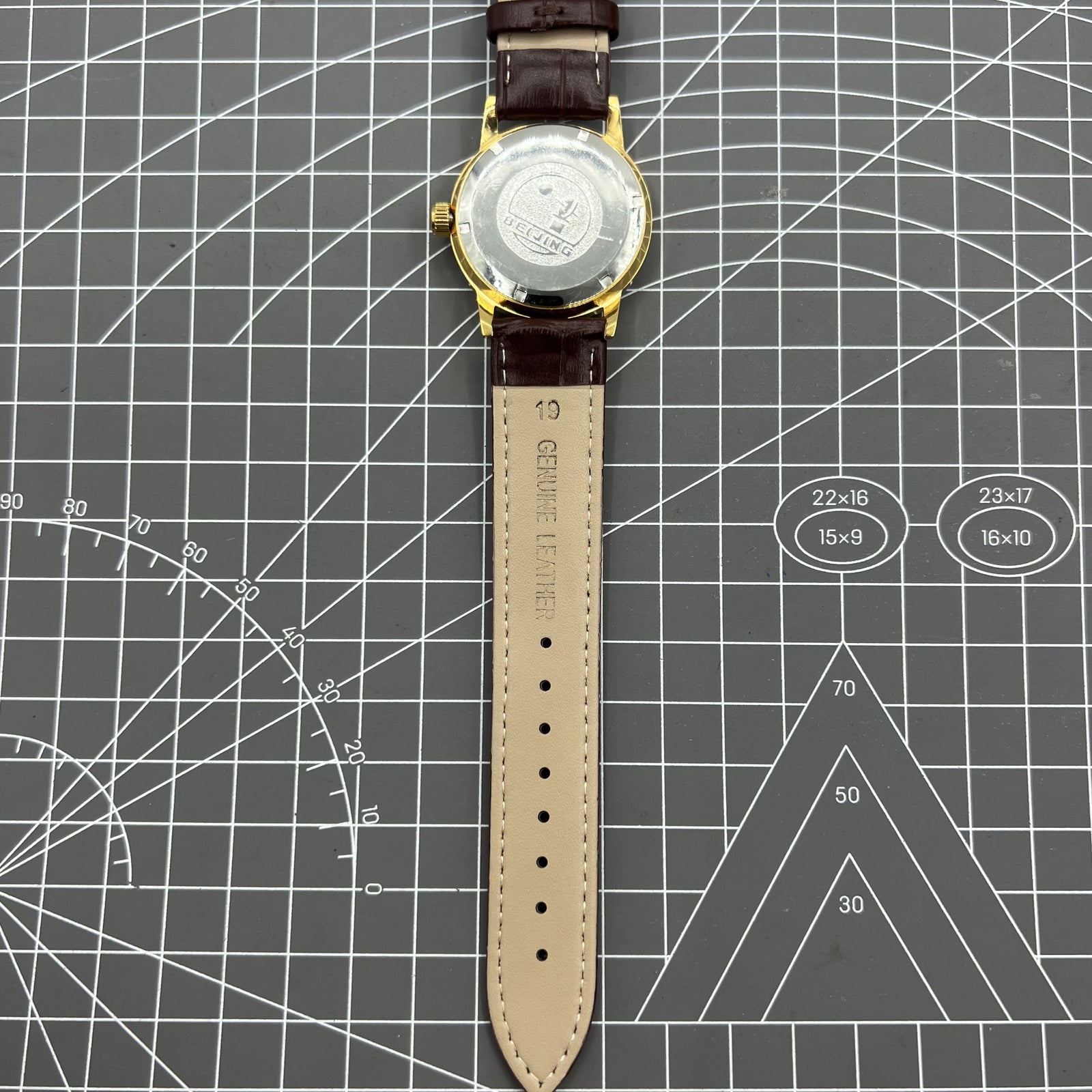 Beijing Double Rhomb manual watch with golden case, silver nail markers, classic style for elegant wear