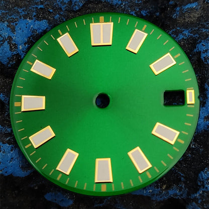 Green luminous watch dial with silver and golden nail trim, compatible with NH35 movement, for elegant timepieces.