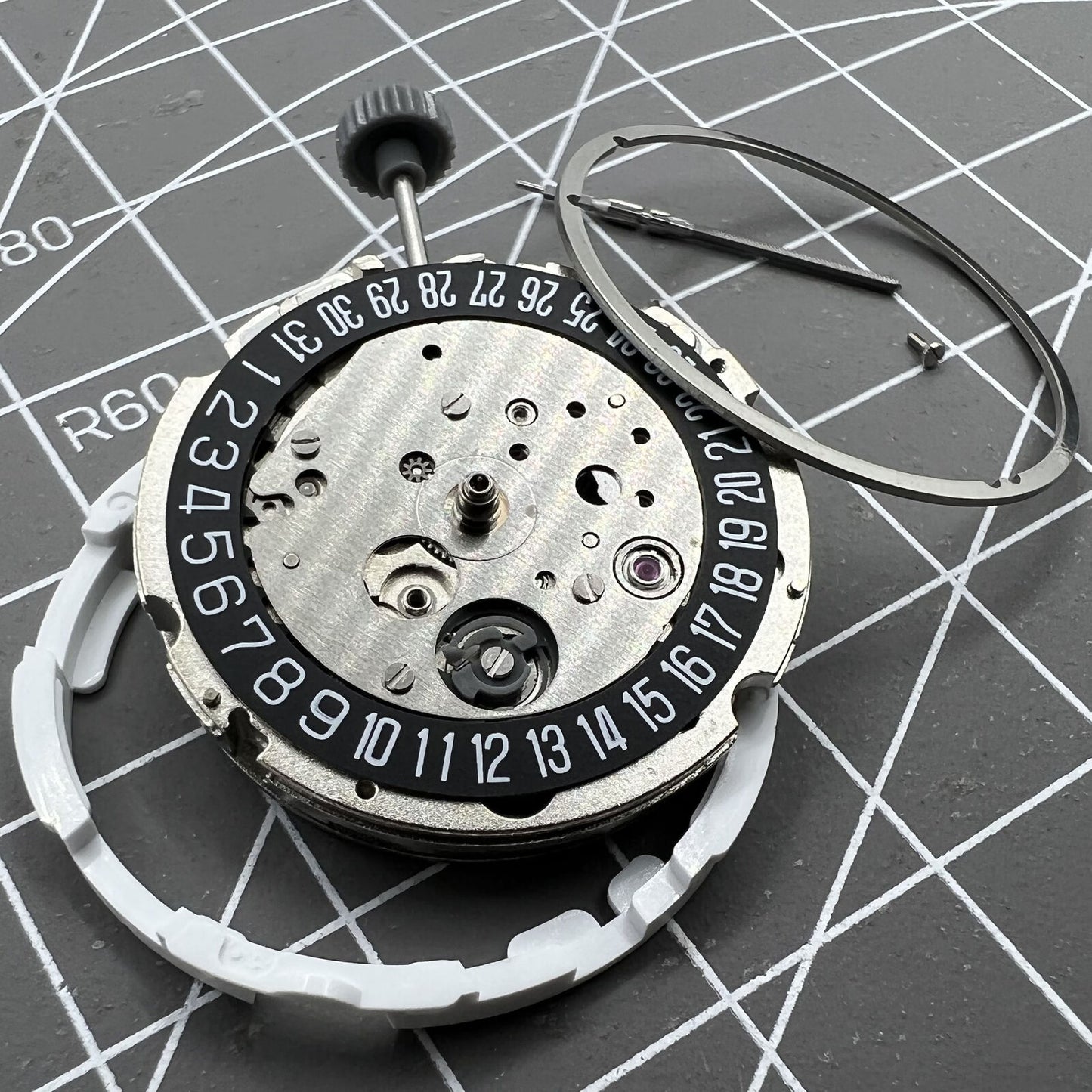 Miyota Citizen 8215 automatic watch movement with black dial, date at 6 o'clock, Japan-made precision.