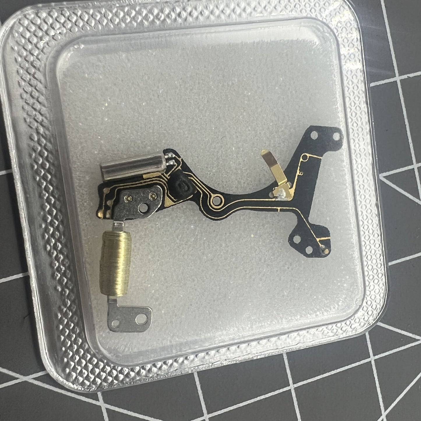 Circuit board for Ronda 7004.N watch movement by Ronda, essential repair part for accurate timing.