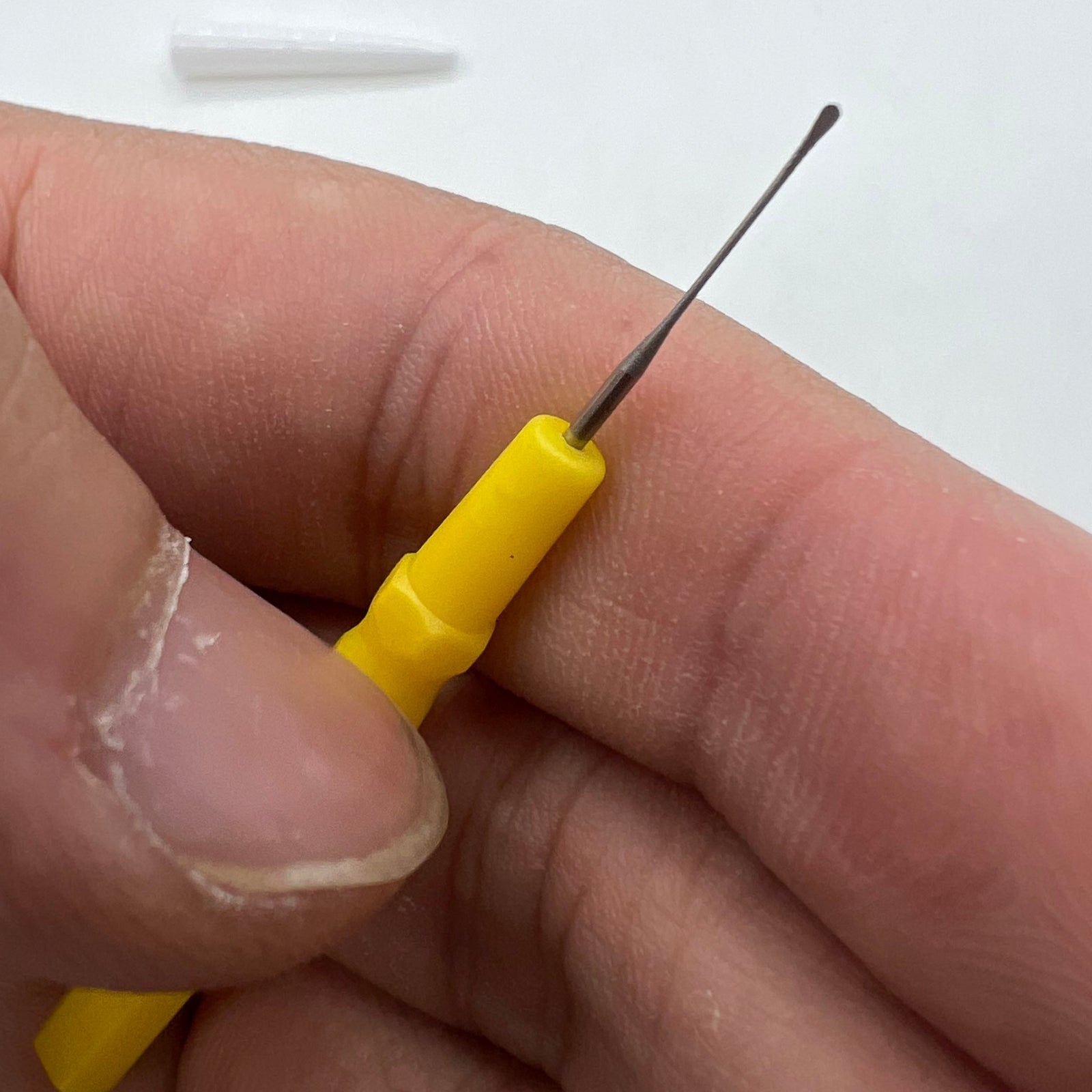 Bergeon 30102-D yellow watch dip oiler for precise Swiss watch repair and maintenance tasks.