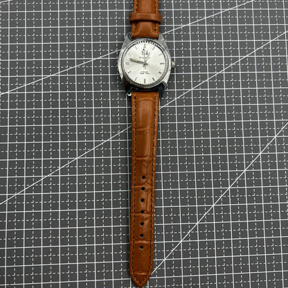 PUBU 32mm manual mechanical watch with grey dial, nail markers, and 17 jewels for precise timekeeping.