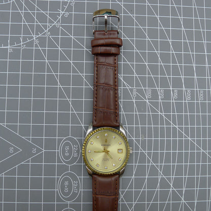 Dandong Peacock 37mm manual watch with golden dial, single calendar, 33 jewels, sleek elegant design accessory.