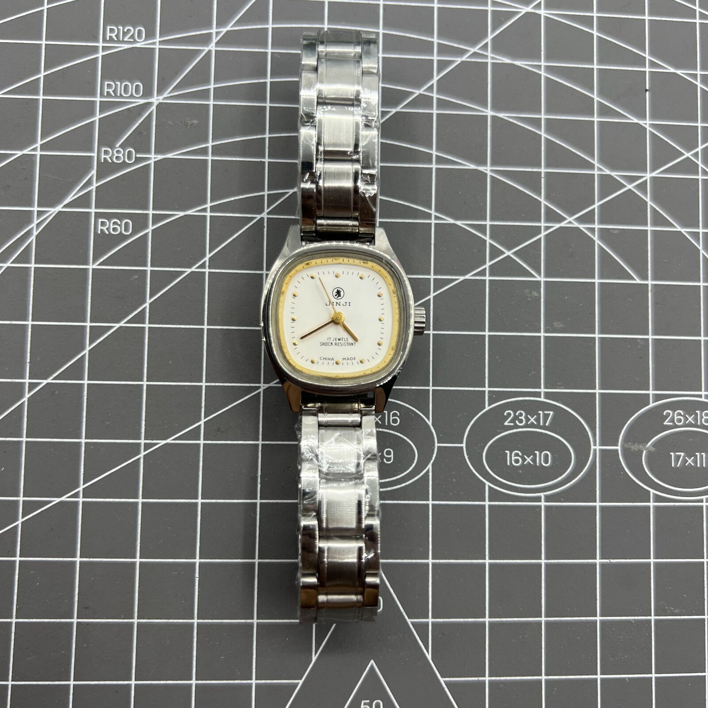 26mm SHANGHAI JINJI Lady Watch with golden square case and manual mechanical movement, elegant 17-jewel design.