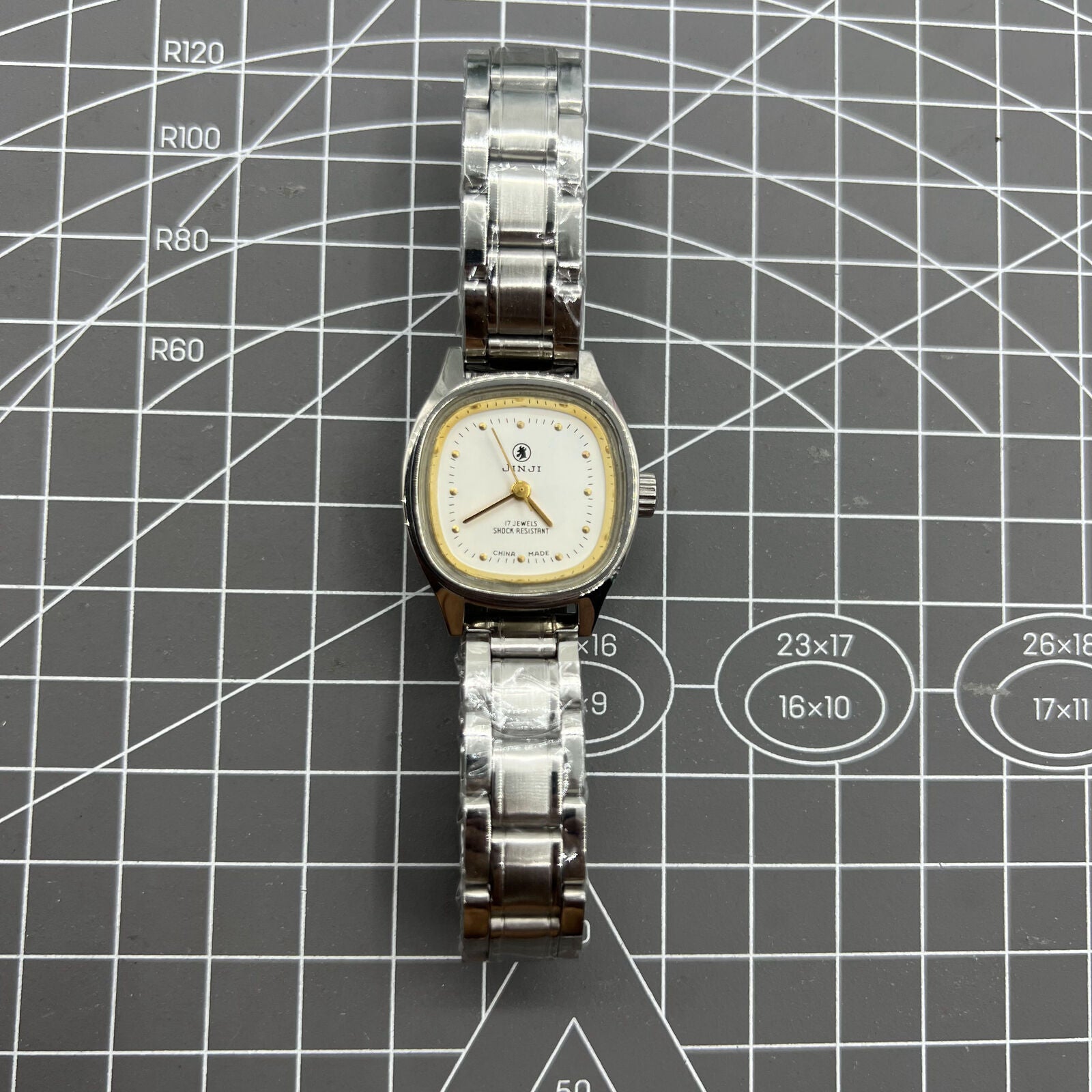 26mm SHANGHAI JINJI Lady Watch with golden square case and manual mechanical movement, elegant 17-jewel design.