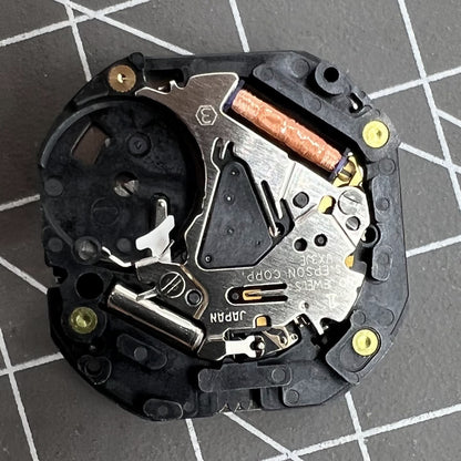 Close-up of Japan Made Hattori Epson TMI VX3J VX3JE quartz watch movement showcasing precise timekeeping by Epson.