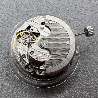 Tianjin ST17 T17 hand-wound watch movement with two hands and power reserve indicator at 10 o'clock.