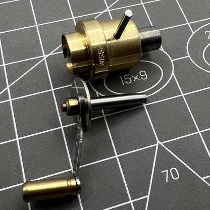Swiss Bergeon 2729 watch mainspring winder with spare barrels for precise ETA calibre repairs.