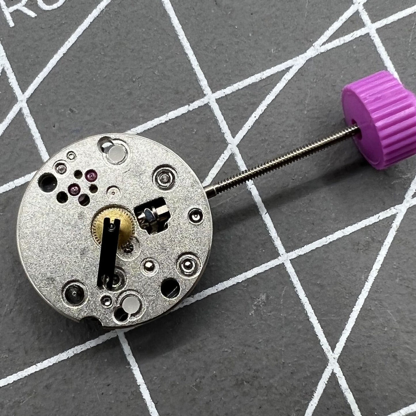 Ronda 1042 quartz watch movement with two hands, precise timekeeping for watch repairs.