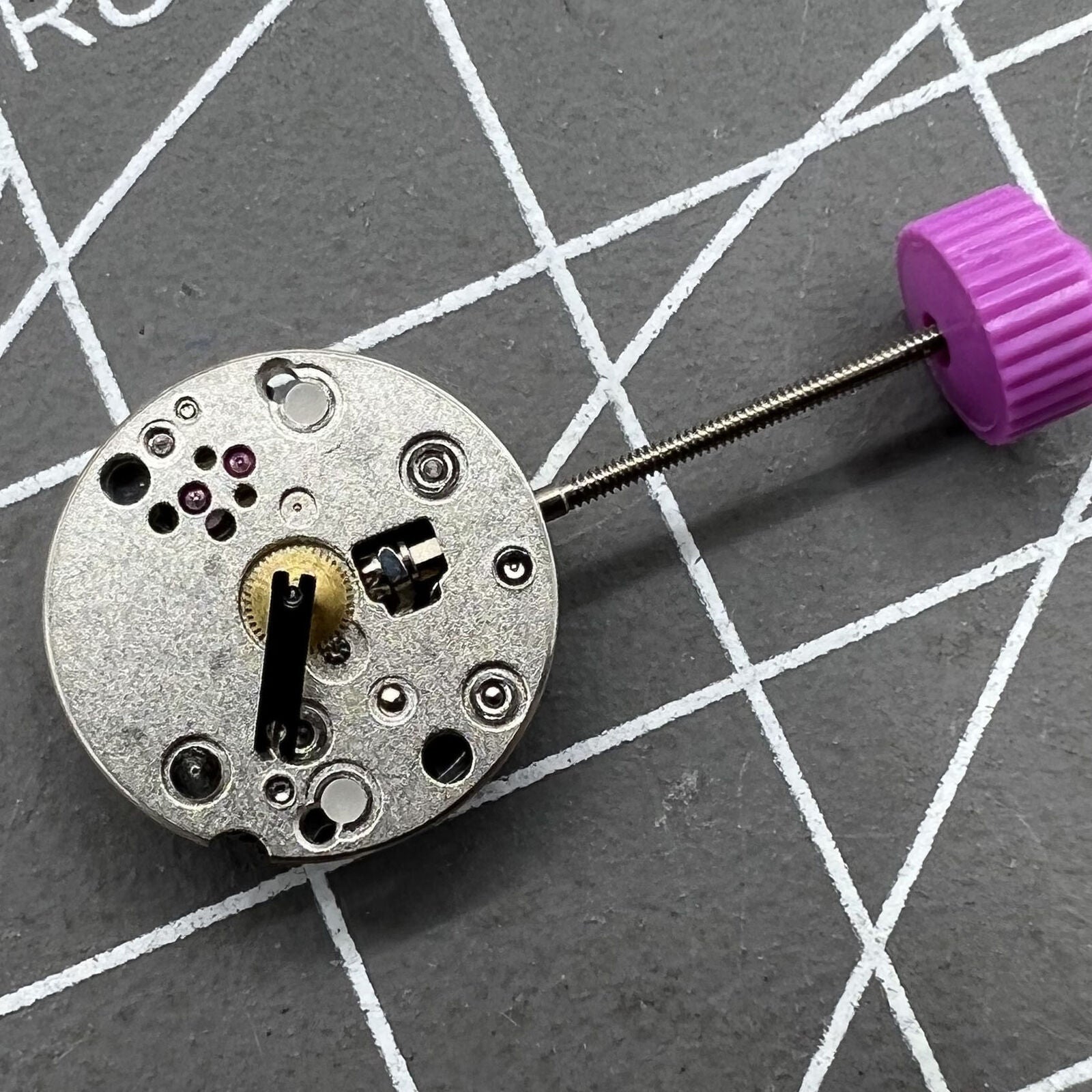 Ronda 1042 quartz watch movement with two hands, precise timekeeping for watch repairs.