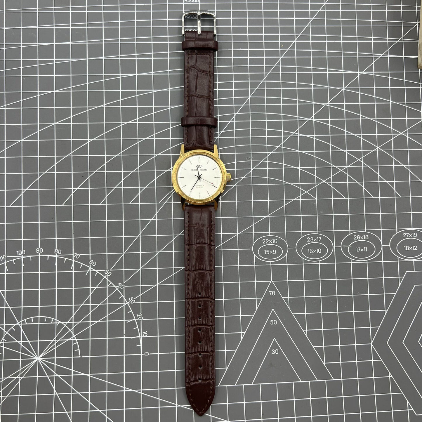 Beijing Double Rhomb mechanical watch with golden case and silver nail markers, elegant design