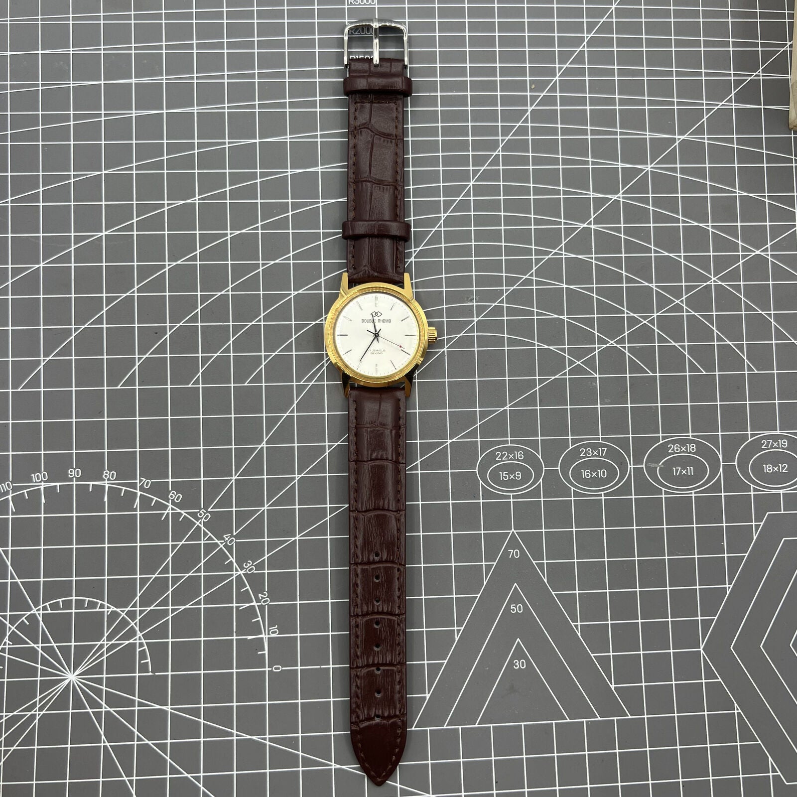 Beijing Double Rhomb mechanical watch with golden case and silver nail markers, elegant design