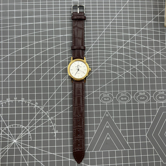 Beijing Double Rhomb mechanical watch with golden case and silver nail markers, elegant design