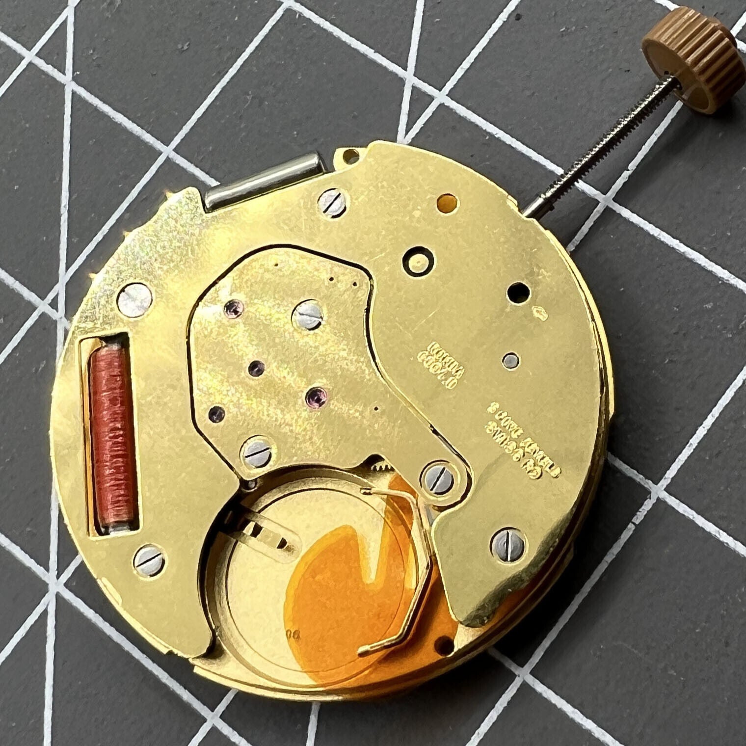 Swiss Made Ronda 6004D quartz watch movement with date window at 3 o?clock for precise timekeeping.