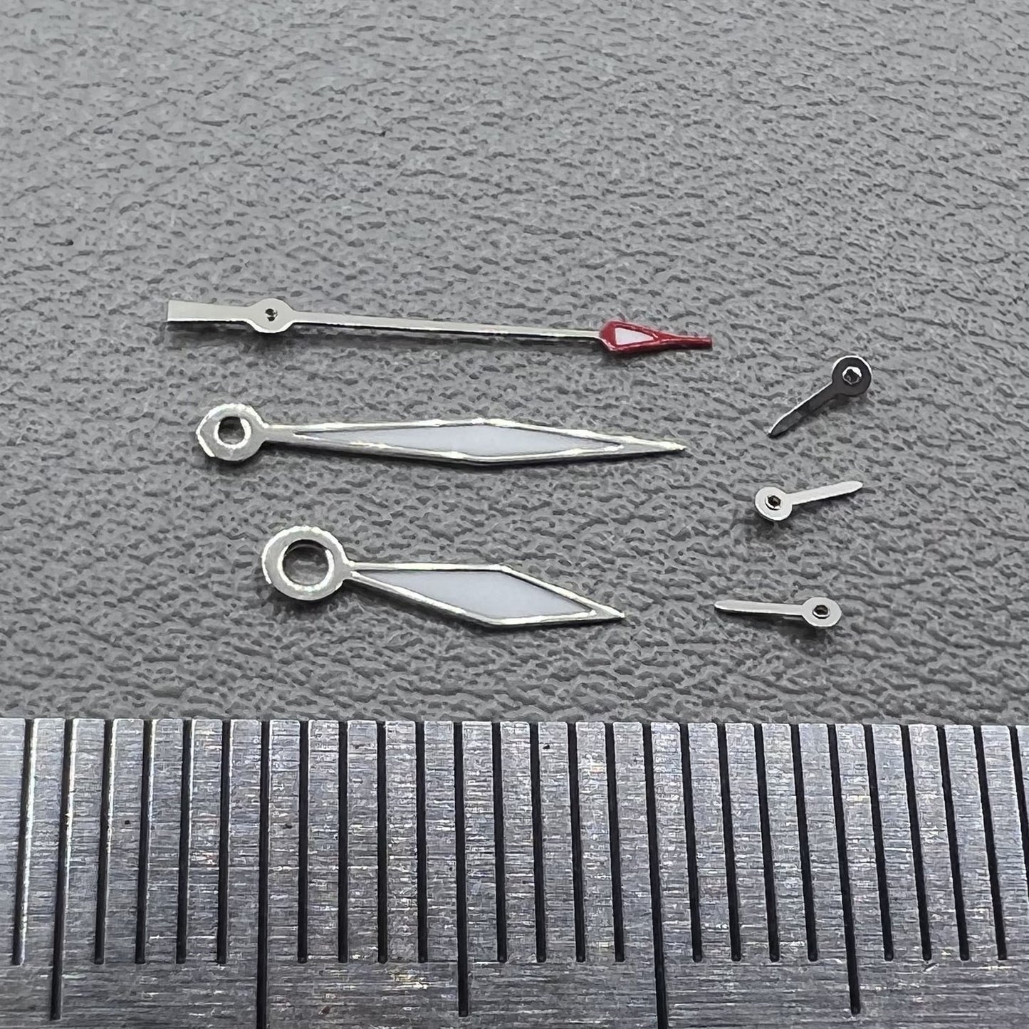 Set of 2 silver trim diamond-shaped lume hands for Miyota JS15 watch movement.
